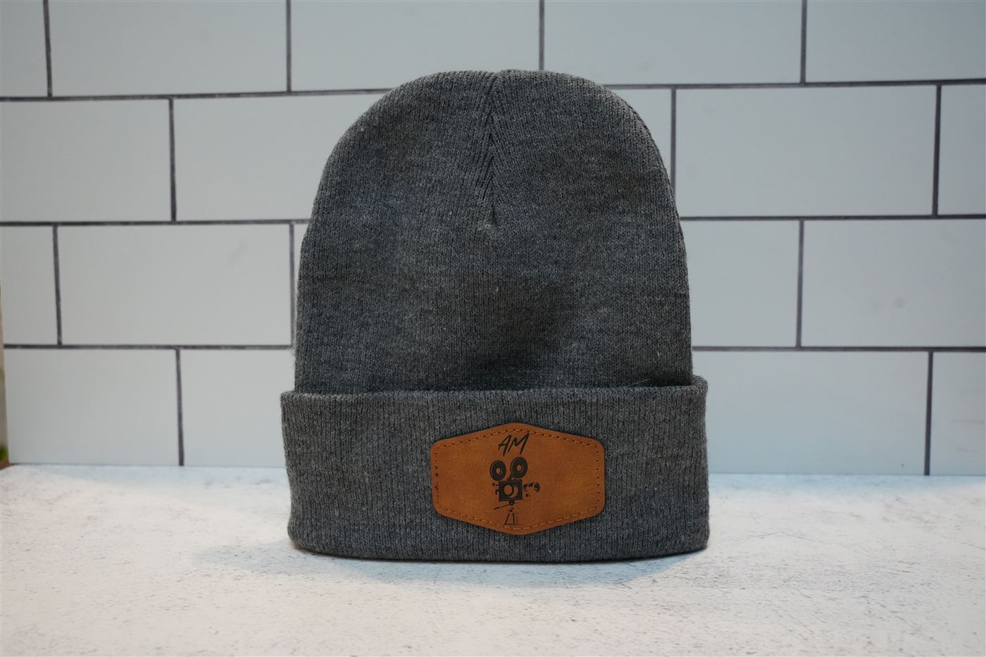 Gray beanie with a custom engraved leatherette patch