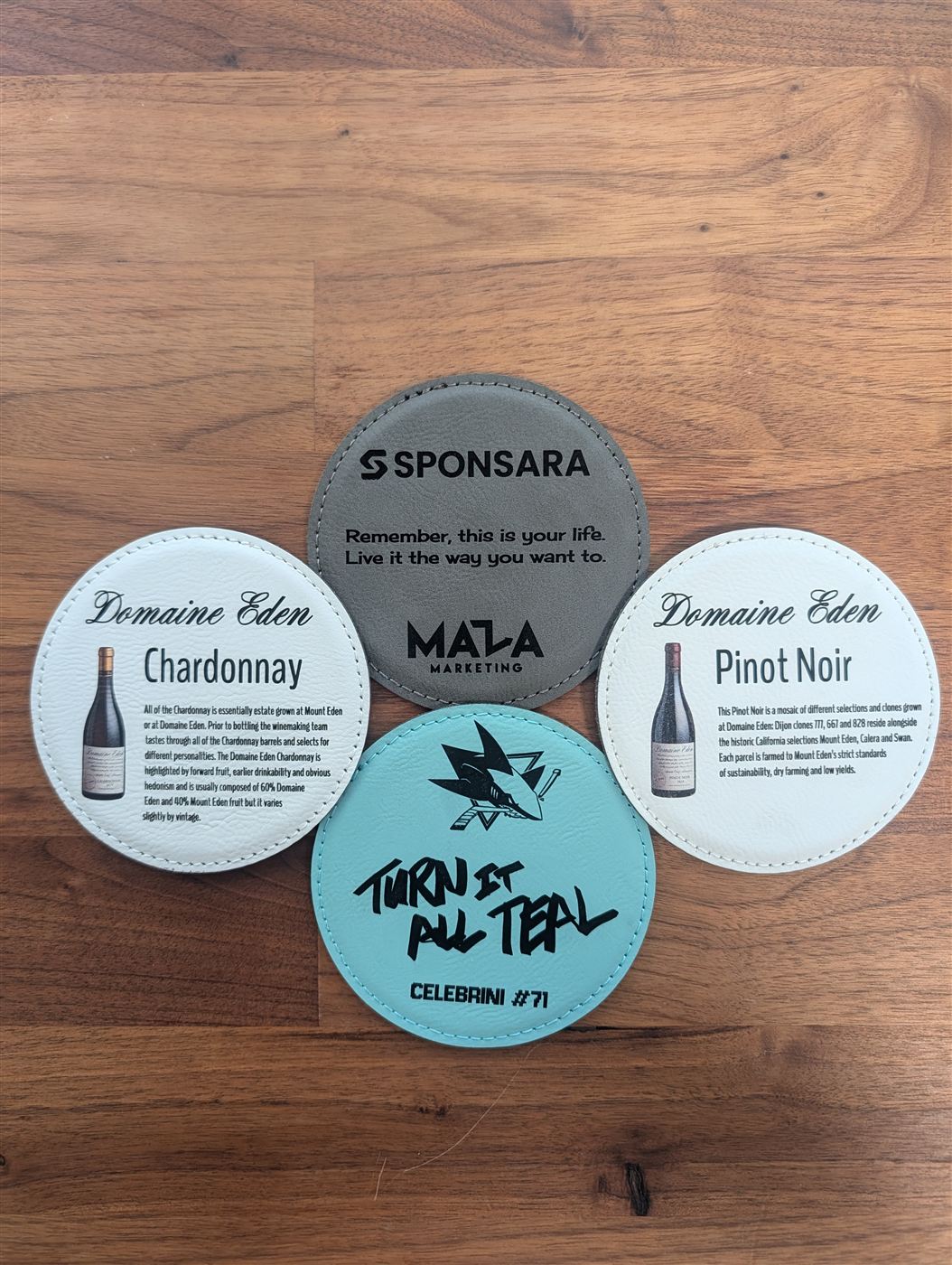 Round leatherette coasters engraved with logos, wine labels, and custom artwork