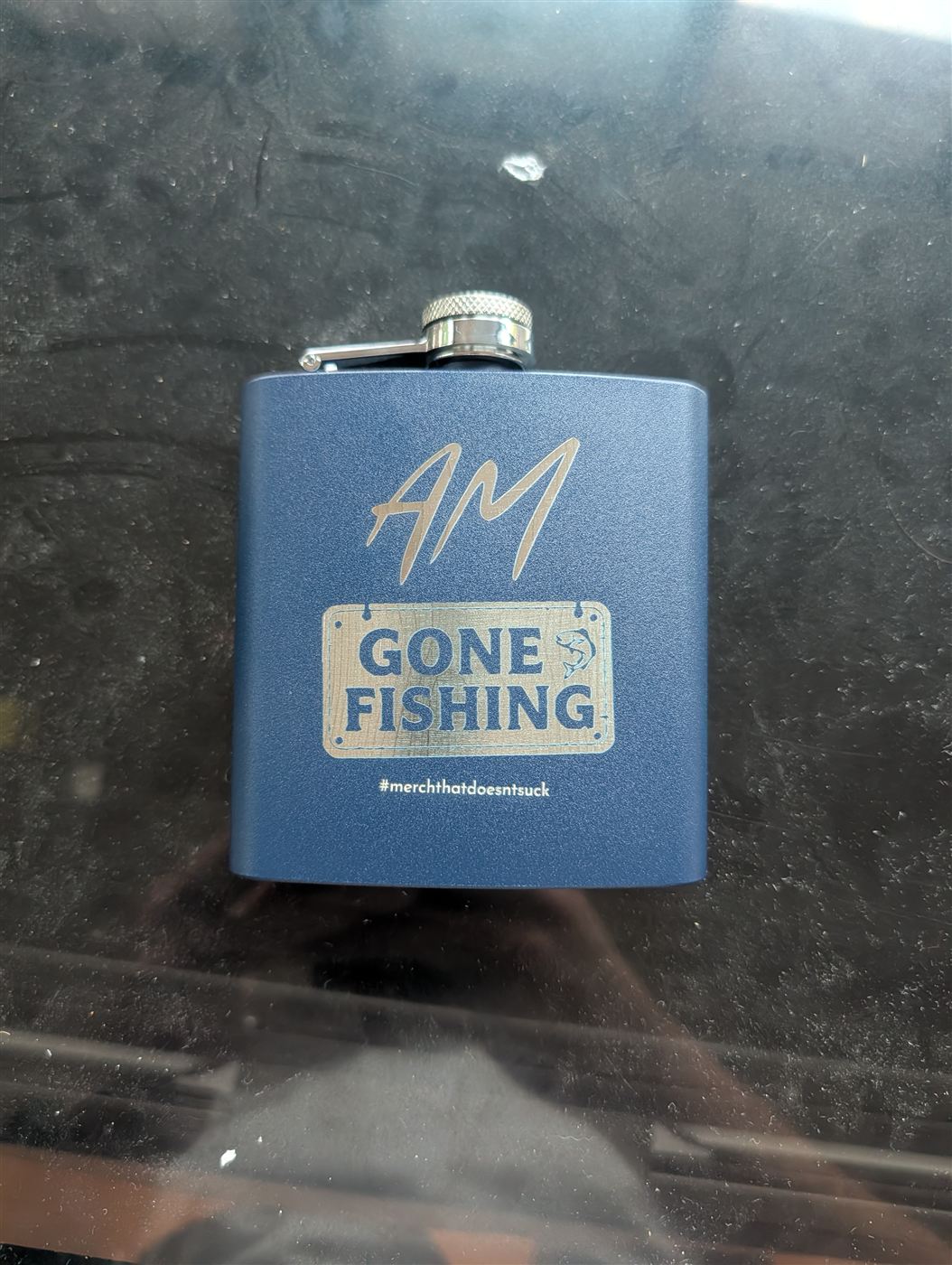 Blue flask engraved with a custom Gone Fishing design