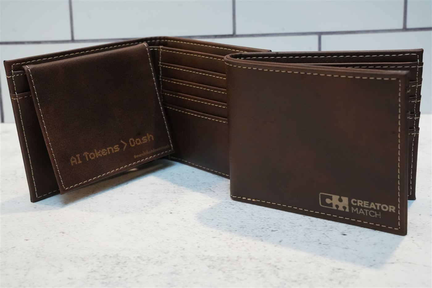Brown leatherette wallets engraved with a company logo and a custom message